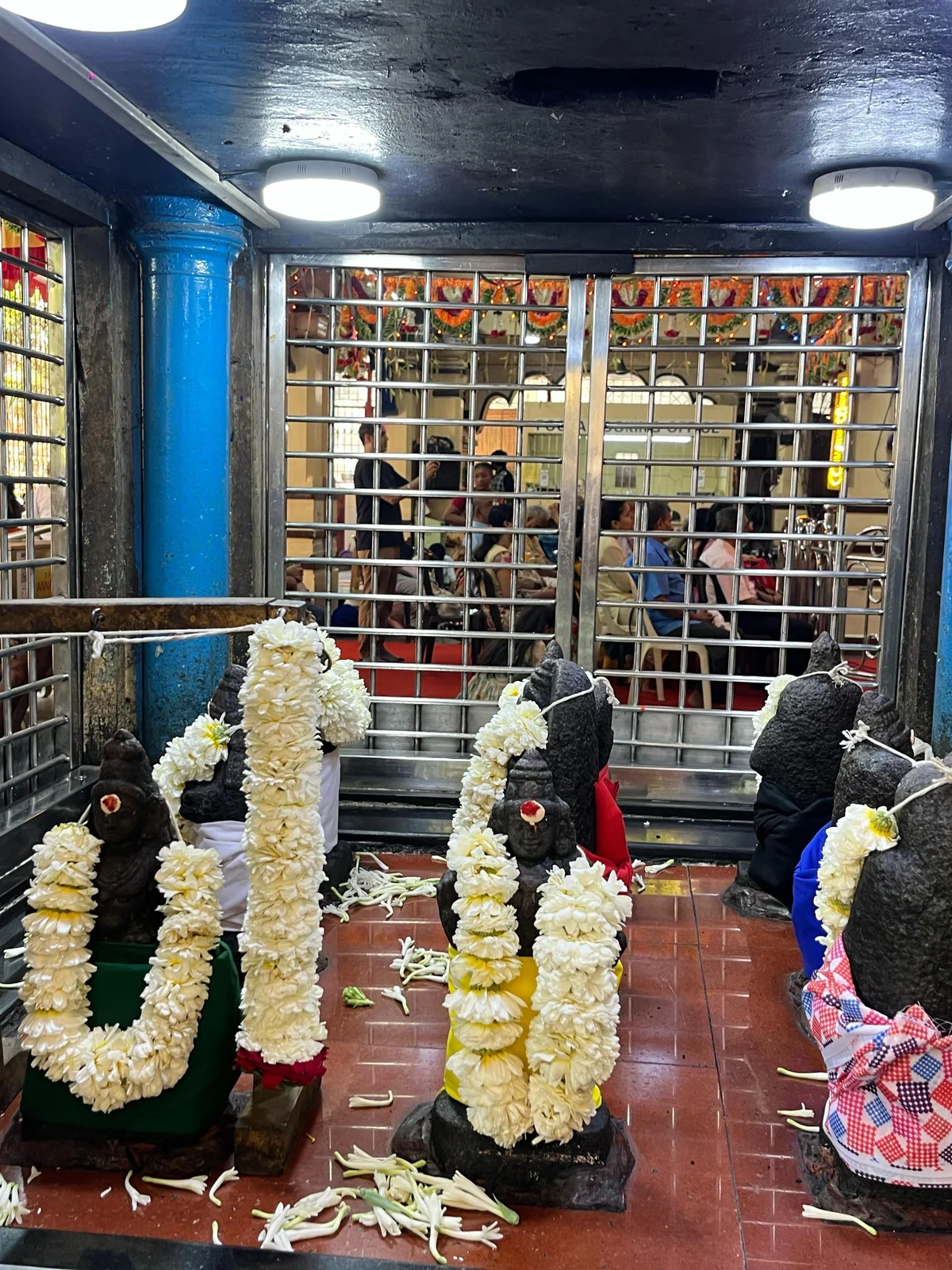 The Navagraha Shrine adorned with jasmine garlands at The South Indian Bhajana Samaj